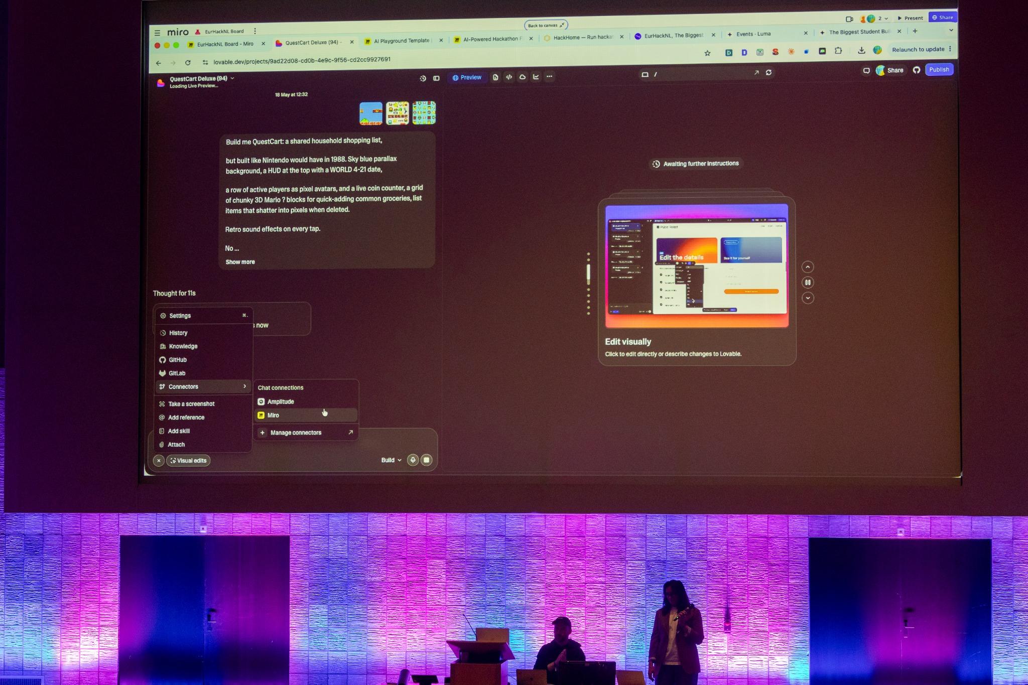 A live product demonstration projected above the stage at the student buildathon in Rotterdam.
