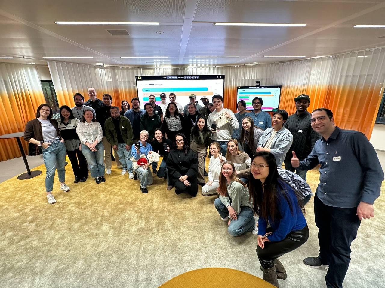 A group of builders posing together at the Miro × Lovable Buildathon in Amsterdam.